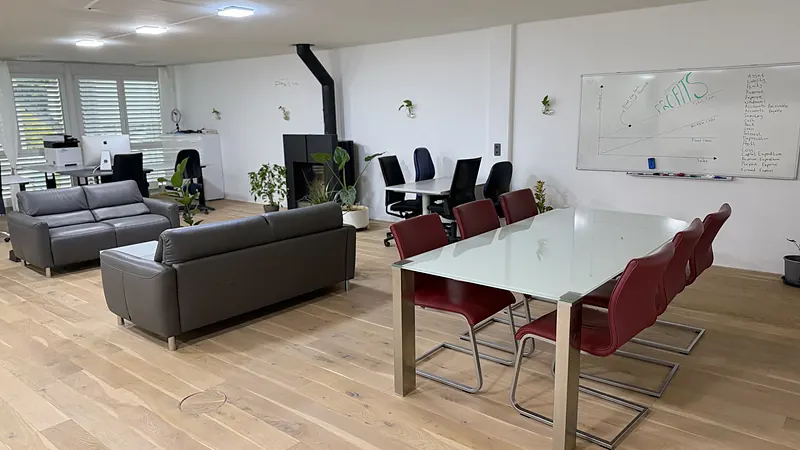 Meeting table with whiteboard in the Webzenz Switzerland office